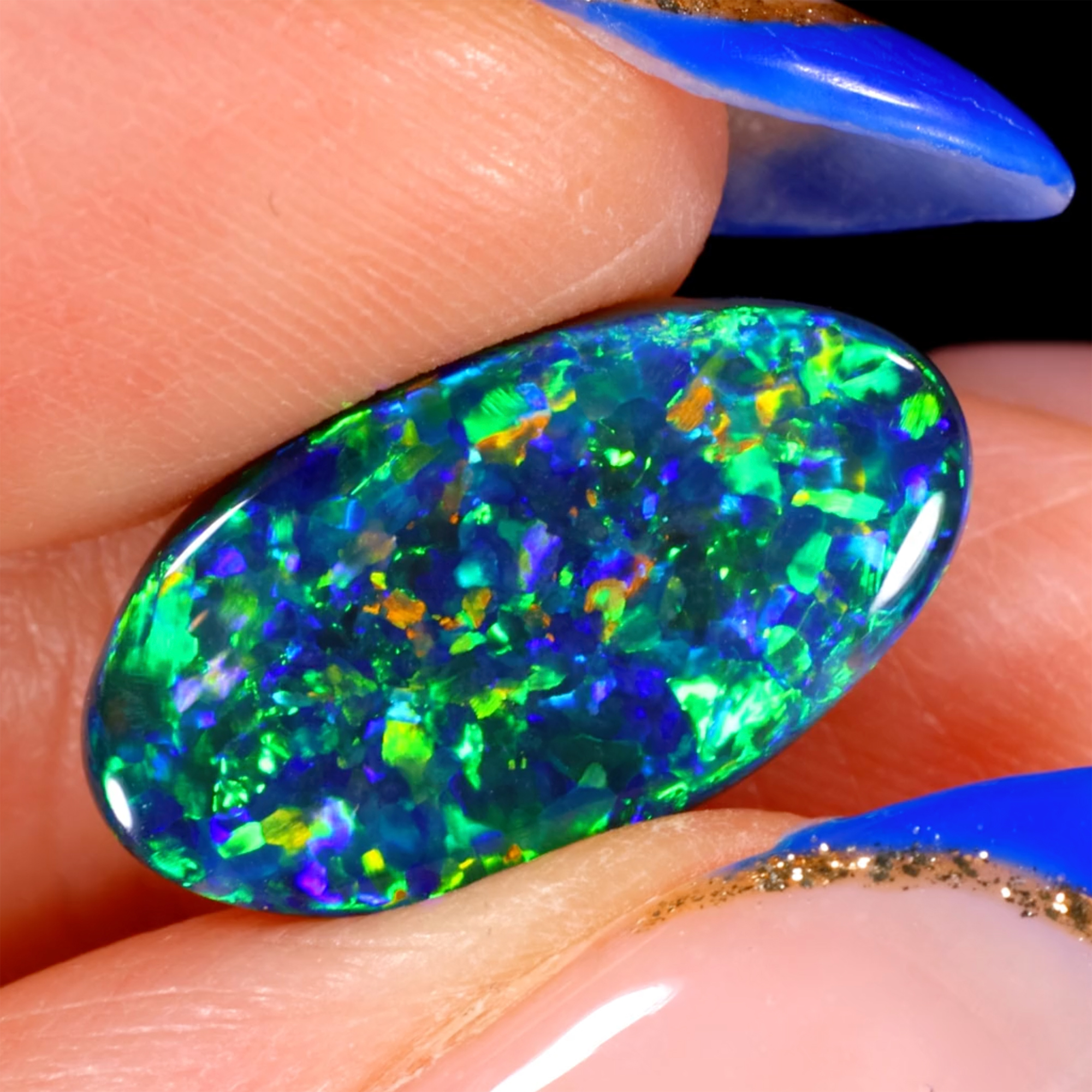 lightning-ridge-black-opal-orange-yellow-green-blue-oval-4-92ct-opal-galaxy