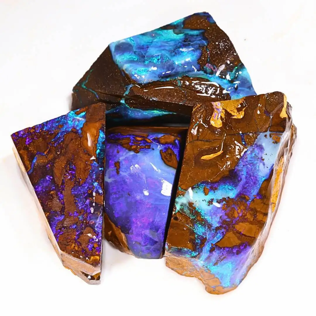 113g boulder opal rubs rough parcel of 4 large pieces from Winton, Australia with fiery violet purple, blue, and teal fire. Natural, untreated Australian opal for collectors or lapidary artists.