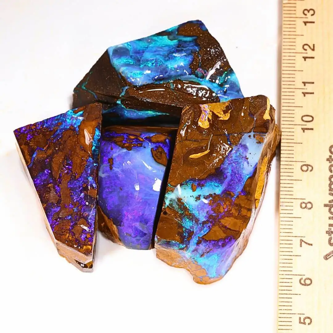 113g boulder opal rubs parcel from Winton, Australia showing intense purple and teal color play through natural ironstone matrix. 100% natural and untreated.