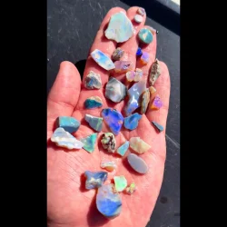 lightning ridge beginner rough opal parcel 300g natural australian opal displayed on hand with blue green color