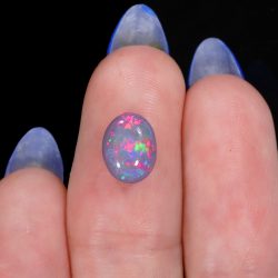 black opal oval cabochon 1.78ct bright pink fire macro opal galaxy