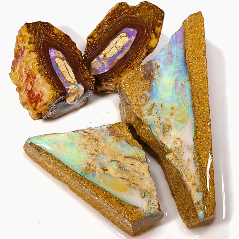 104g boulder opal splits rough parcel of 4 pieces from Koroit and Winton, Australia. Includes purple Koroit nut splits and pastel pipe crystal opal splits. Natural, untreated.