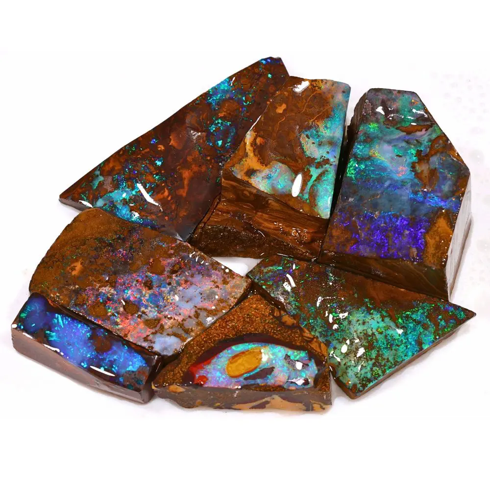 133g boulder opal rubs rough pendant parcel of 7 pieces from Winton, Australia with green, teal, purple, and pink fire through natural ironstone matrix. Natural, untreated.