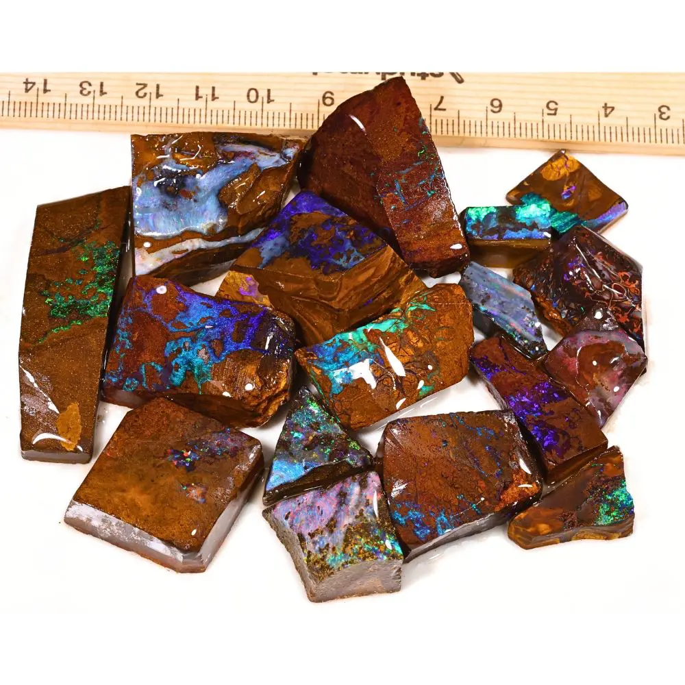188g boulder opal rubs parcel from Winton, Australia showing blue, purple, and green color play through natural ironstone matrix. 100% natural and untreated.