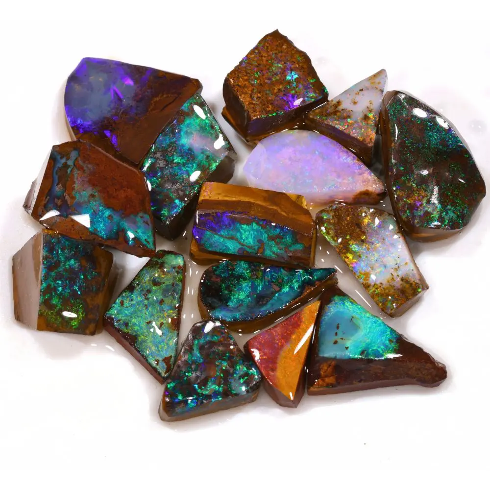 205ct boulder opal rubs rough ringstone parcel of 15 pieces from Winton, Australia with green, teal, purple, and pink fire through natural ironstone matrix. Natural, untreated.