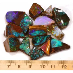 205ct boulder opal rubs ringstone parcel from Winton, Australia showing vivid green, teal, and purple color play through natural ironstone matrix. 100% natural and untreated.
