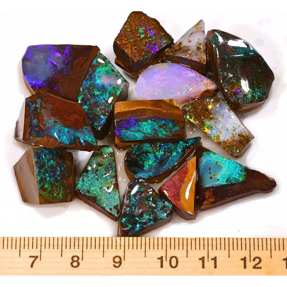 205ct boulder opal rubs ringstone parcel from Winton, Australia showing vivid green, teal, and purple color play through natural ironstone matrix. 100% natural and untreated.