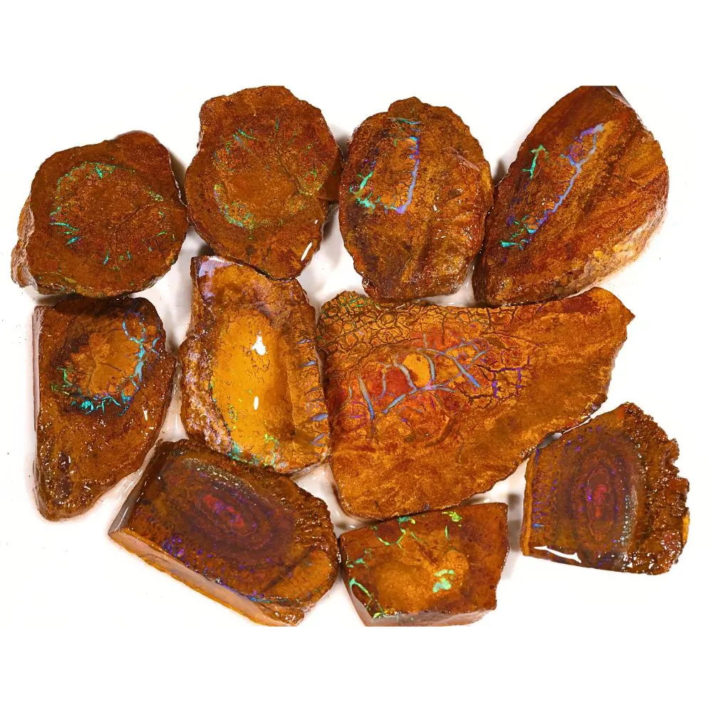 293g Koroit boulder opal matrix rubs rough parcel of 10 pieces from Queensland, Australia with golden amber ironstone, teal veining, and purple concentric ring patterns. Natural, untreated.