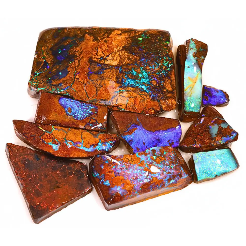 299ct boulder opal rubs rough parcel of 10 pieces from Queensland, Australia with blue, purple, and teal fire through reddish brown ironstone matrix. Natural, untreated.