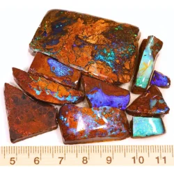 299ct boulder opal rubs parcel from Queensland, Australia showing blue, purple, and green color play through natural ironstone matrix. 100% natural and untreated.