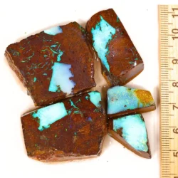 328ct Koroit boulder opal rubs parcel from Queensland, Australia showing vivid sky blue opal pockets and green veining through natural ironstone matrix. 100% natural and untreated.