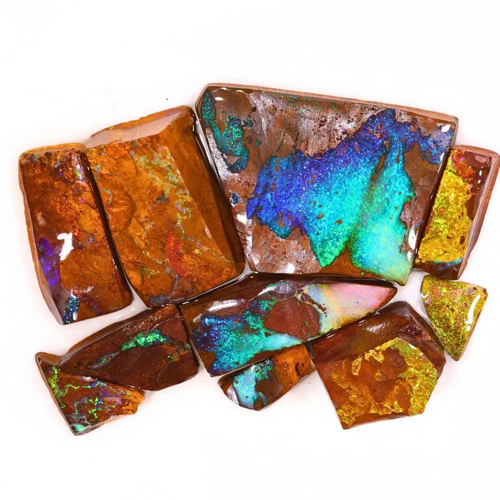 374ct boulder opal rubs rough parcel of 10 pieces from Queensland, Australia with blue, teal, green, and gold fire through warm brown ironstone matrix. Natural, untreated.