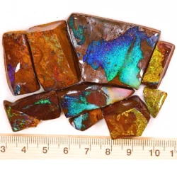 374ct boulder opal rubs parcel from Queensland, Australia showing vivid blue, teal, and gold color play through natural ironstone matrix. 100% natural and untreated.