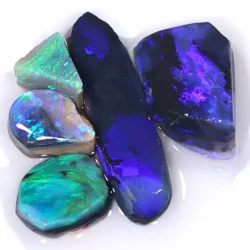 38ct Lightning Ridge black opal rubs parcel of 5 pieces from Australia with deep blue, purple, green, and teal fire on dark body tones. Natural, untreated.