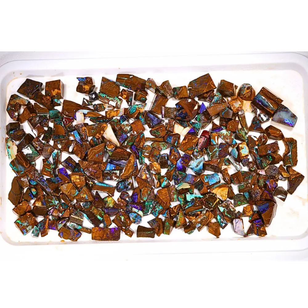 415g boulder opal chips rough parcel of over 250 pieces from Winton, Australia with green, teal, purple, and blue fire through natural ironstone matrix. Natural, untreated.