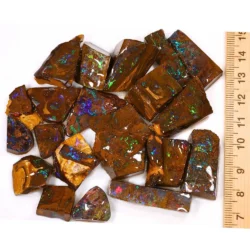 470ct rainbow boulder opal matrix rubs parcel from Winton, Australia showing dense green, purple, red, and blue pinfire through natural ironstone matrix. 100% natural and untreated.