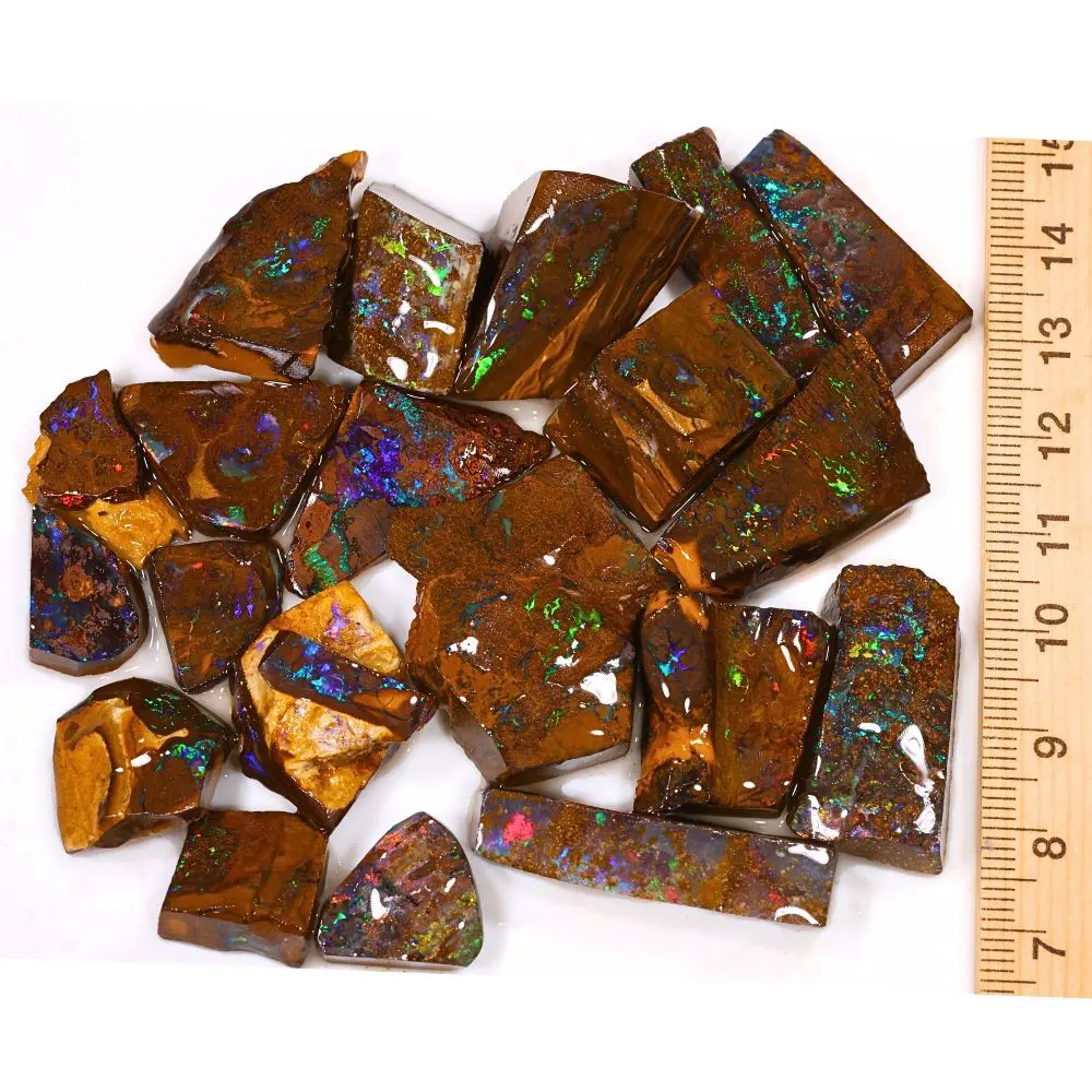 470ct rainbow boulder opal matrix rubs parcel from Winton, Australia showing dense green, purple, red, and blue pinfire through natural ironstone matrix. 100% natural and untreated.