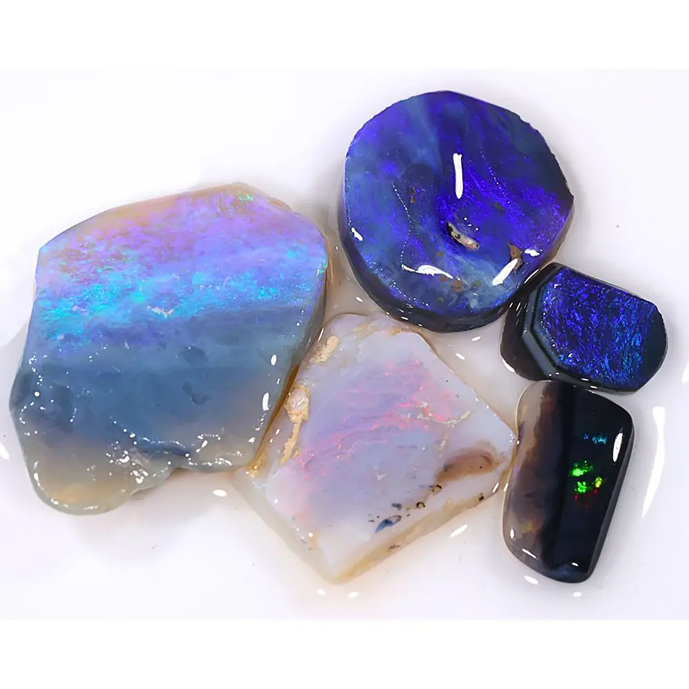 60ct Lightning Ridge opal rubs parcel of 5 pieces from Australia featuring crystal, black, and white opal with purple, blue, teal, and green fire. Natural, untreated.