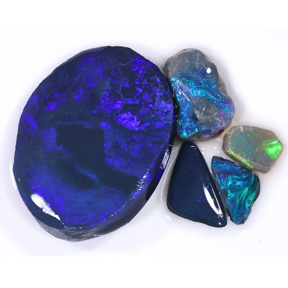 78ct Lightning Ridge black opal rubs parcel of 5 pieces from Australia with deep blue, purple, and teal fire on dark body tones. Natural, untreated.