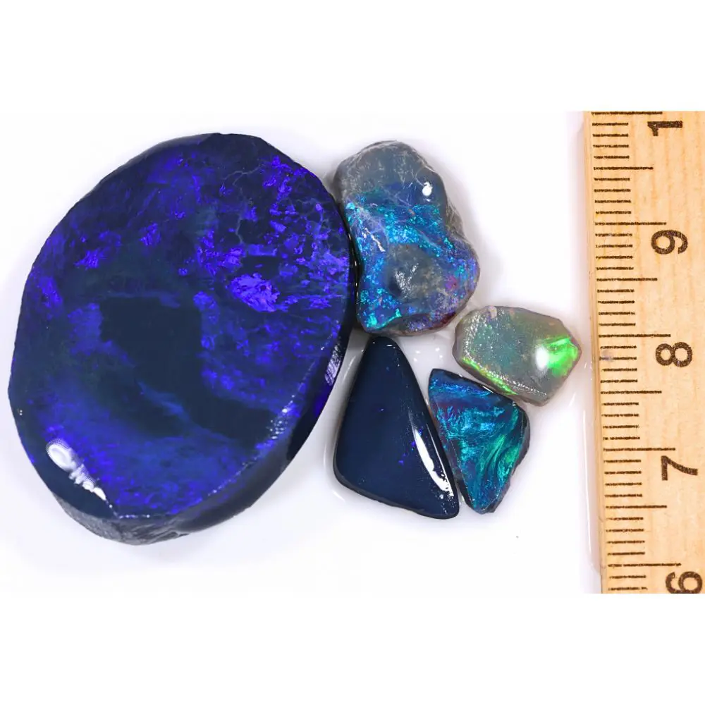 78ct Lightning Ridge black opal rubs parcel from Australia showing deep blue and purple fire on the large piece with teal and green fire on smaller stones. 100% natural and untreated.