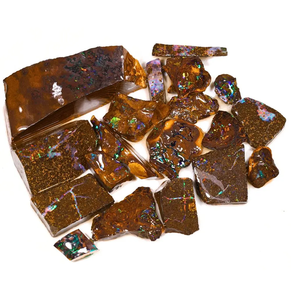 84g rainbow boulder opal matrix rubs rough parcel of 19 pieces from Winton, Australia with multicolor pinfire including green, pink, purple, and blue through dark ironstone. Natural, untreated.