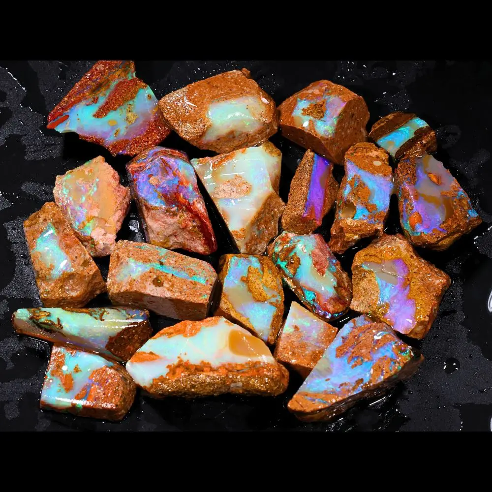 374ct crystal boulder opal rubs rough parcel of 20 pieces from Winton, Australia with pastel blue, green, purple, and red crystal opal in natural sandstone matrix. Natural, untreated.