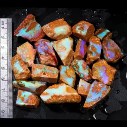 374ct crystal boulder opal rubs parcel from Winton, Australia showing translucent pastel opal with blue, green, and purple fire across broad polished faces. 100% natural and untreated.