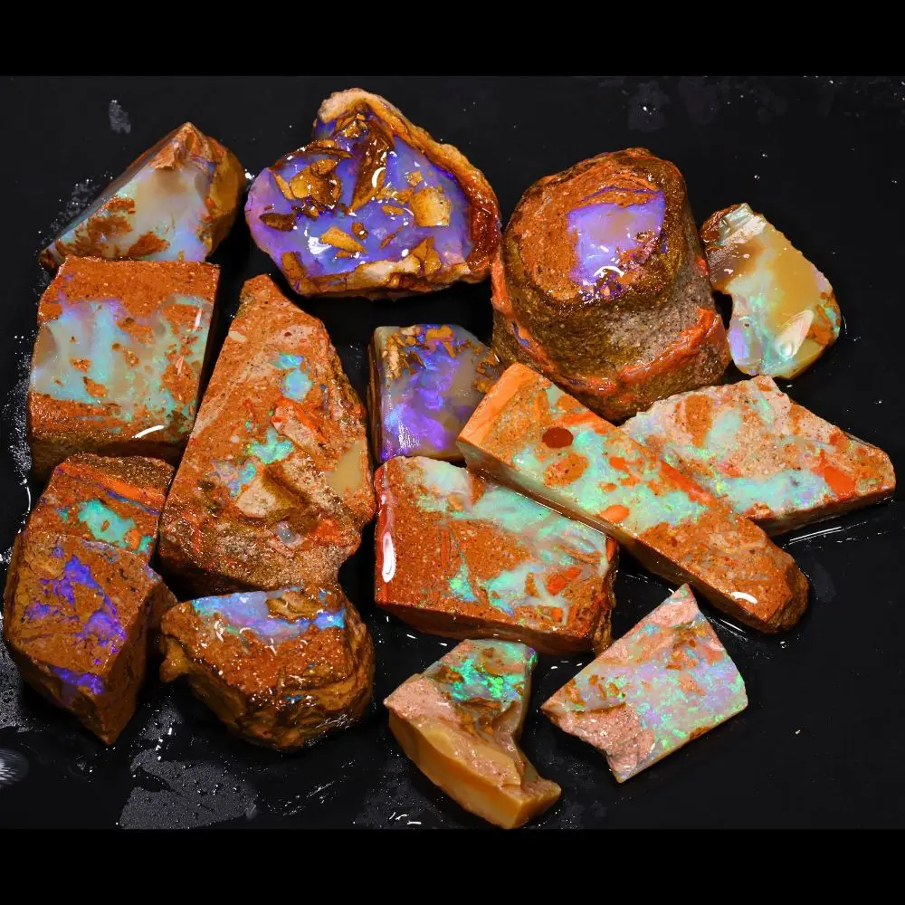542ct crystal boulder opal rubs rough parcel of 15 pieces from Winton, Australia including a purple gamble piece plus teal, blue, and green crystal opal. Natural, untreated.