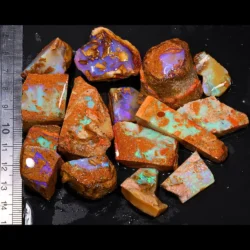 542ct crystal boulder opal rubs parcel from Winton, Australia showing a rounded purple gamble stone alongside teal and blue crystal opal pieces. 100% natural and untreated.