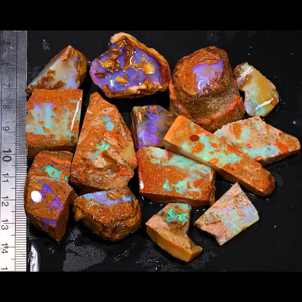 542ct crystal boulder opal rubs parcel from Winton, Australia showing a rounded purple gamble stone alongside teal and blue crystal opal pieces. 100% natural and untreated.
