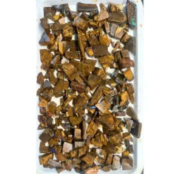 650g boulder opal chips rough parcel from Winton, Australia with blue, green, and purple fire through golden brown ironstone. Natural, untreated inlay material.
