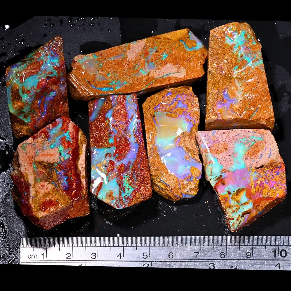 861ct crystal boulder opal rubs parcel from Winton, Australia showing translucent blue and purple crystal fire across large polished faces. 100% natural and untreated.