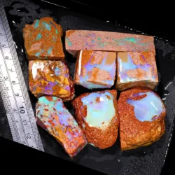 861ct crystal boulder opal rubs parcel from Winton, Australia showing translucent blue and purple crystal fire across large polished faces. 100% natural and untreated.