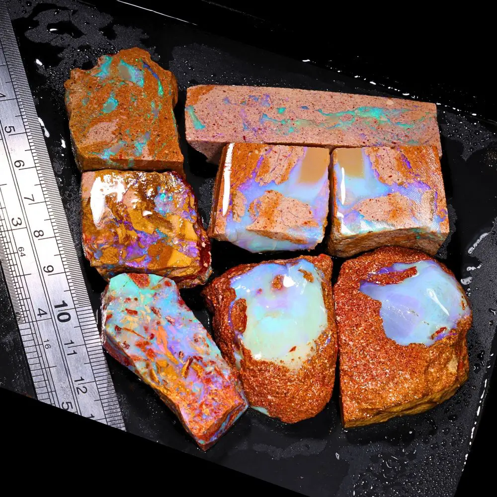 861ct crystal boulder opal rubs parcel from Winton, Australia showing translucent blue and purple crystal fire across large polished faces. 100% natural and untreated.