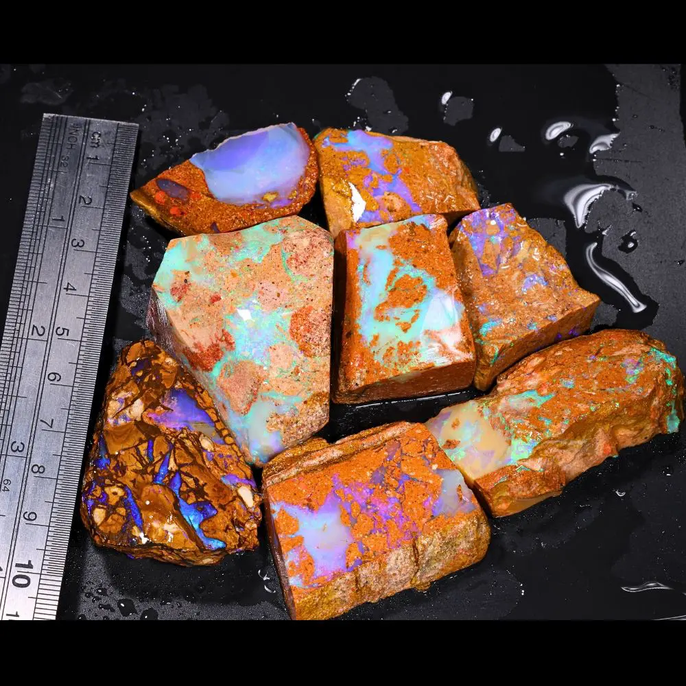 888ct crystal boulder opal rubs parcel from Winton, Australia showing translucent blue and purple crystal fire across large polished faces. 100% natural and untreated.