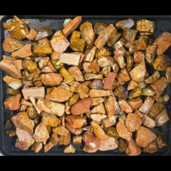 Crystal Boulder Opal rough parcel from Winton Australia showing 1.8kg of mixed natural ironstone and colorful opal rough pieces