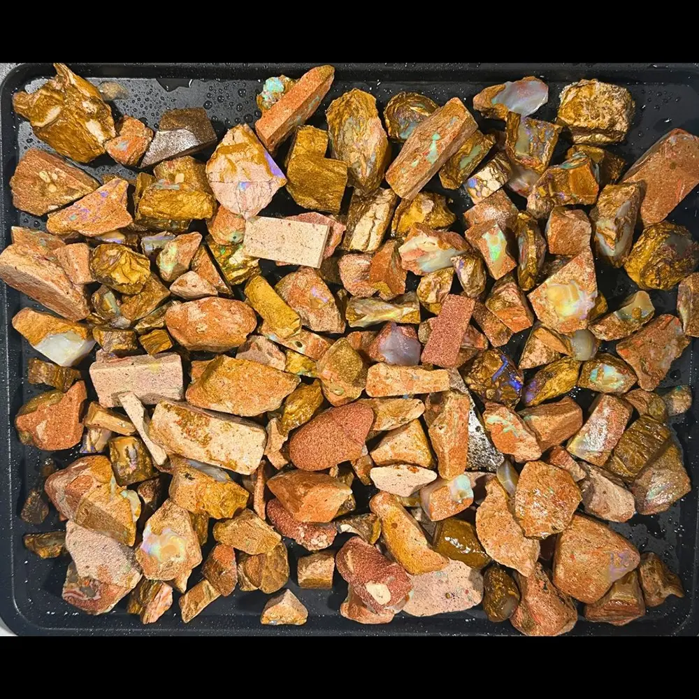Crystal Boulder Opal rough parcel from Winton Australia showing 1.8kg of mixed natural ironstone and colorful opal rough pieces