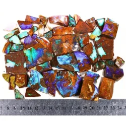 Boulder opal rubs parcel with ruler for size reference, Winton Queensland rough opal