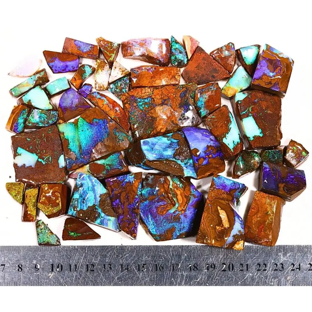 Boulder opal rubs parcel with ruler for size reference, Winton Queensland rough opal