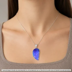 Natural purple and blue Australian boulder opal pendant shown worn on a silver chain for illustrative styling reference