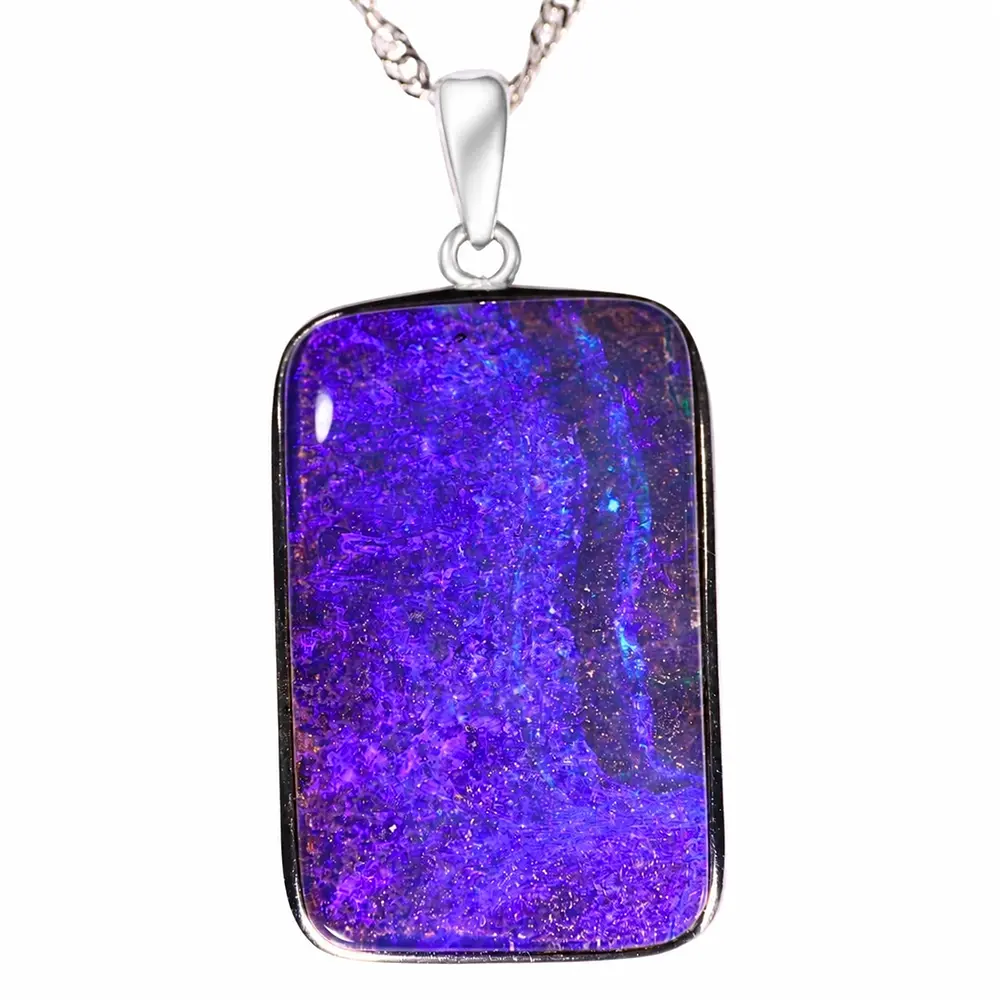 Close view of 37.3 ct purple boulder opal pendant from Winton Australia set in rhodium plated sterling silver