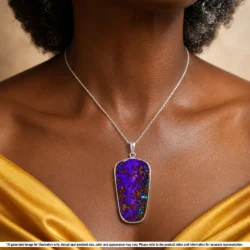 Large purple and green Australian boulder opal pendant shown worn on a silver chain for illustrative styling reference