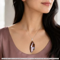 Australian wood fossil boulder opal pendant shown worn on a silver chain with pink orange and green color in natural matrix