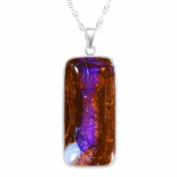 62.7 ct purple wood fossil boulder opal pendant from Winton in S925 sterling silver on a white background