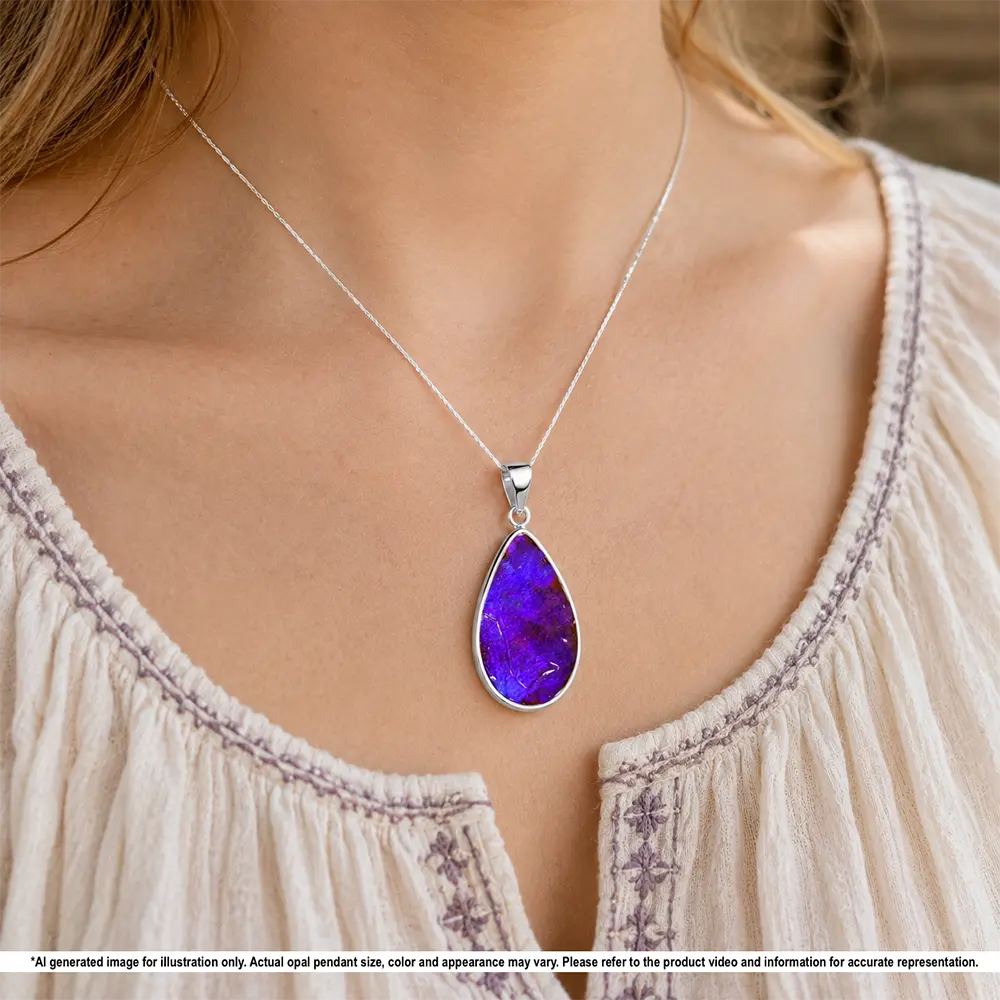 Natural 29 ct Winton boulder opal pendant shown worn on a silver chain with rich purple color and teardrop shape