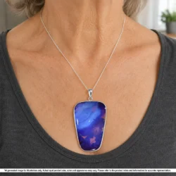 Natural purple Australian boulder opal pendant with blue tones and ironstone matrix shown worn on a silver chain