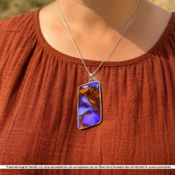 Purple Australian boulder opal pendant shown worn on a silver chain with natural brown matrix and rhodium plated silver setting