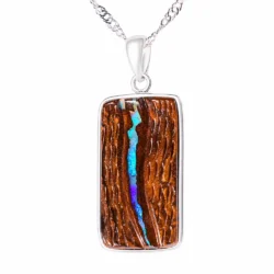 22.4 ct hand carved boulder opal pendant from Winton Australia with purple green opal seam in brown ironstone matrix and sterling silver setting