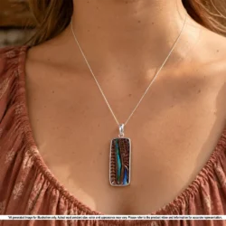 Natural green yellow Australian boulder opal pendant shown worn on a silver chain with rectangular hand carved ironstone matrix