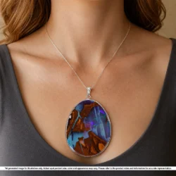 Large Australian boulder opal pendant shown worn on a silver chain with purple green color and natural matrix